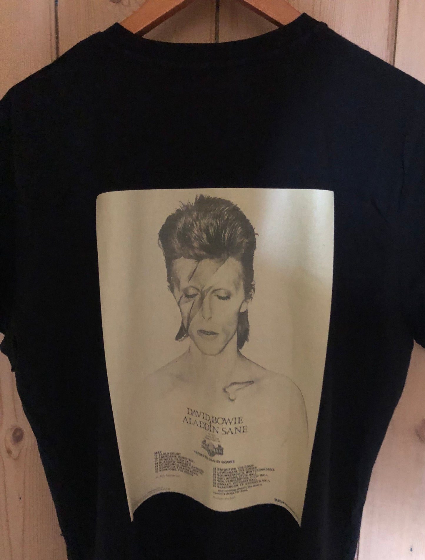 DAVID BOWIE - 1973 “ Aladdin Sane tour “ T Shirt . Featuring the tour advert and corresponding ticket.
