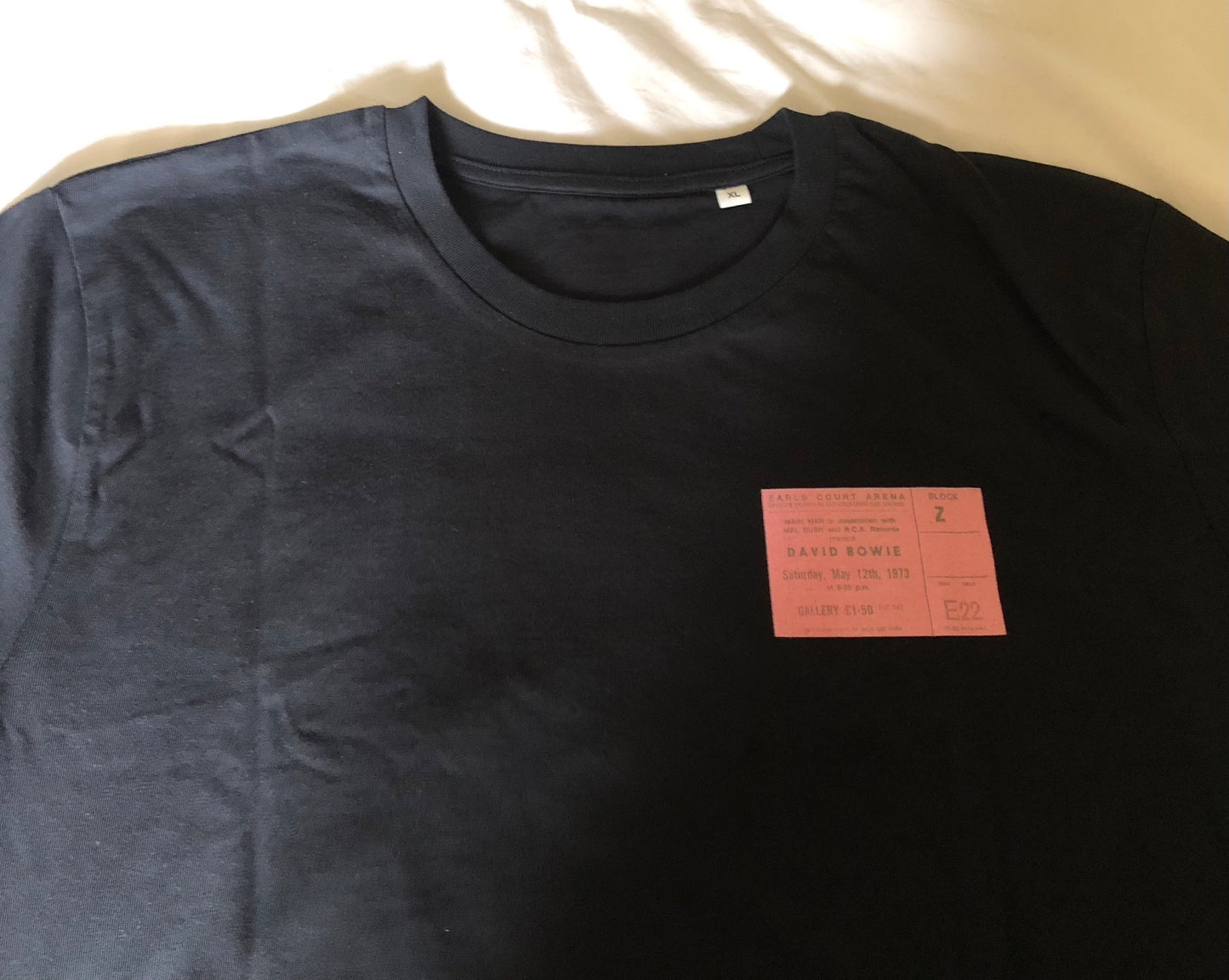 DAVID BOWIE - 1973 “ Aladdin Sane tour “ T Shirt . Featuring the tour advert and corresponding ticket.