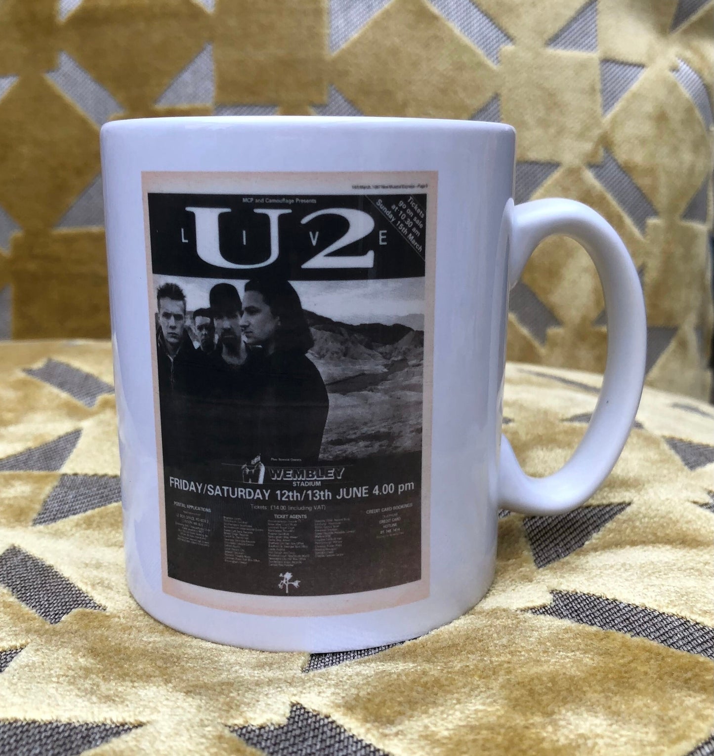 U2 - 11oz ceramic mug featuring the 1987 “ Joshua Tree tour” featuring the Wembley Stadium , London ticket on one side of the mug and the corresponding tour advert on the other side