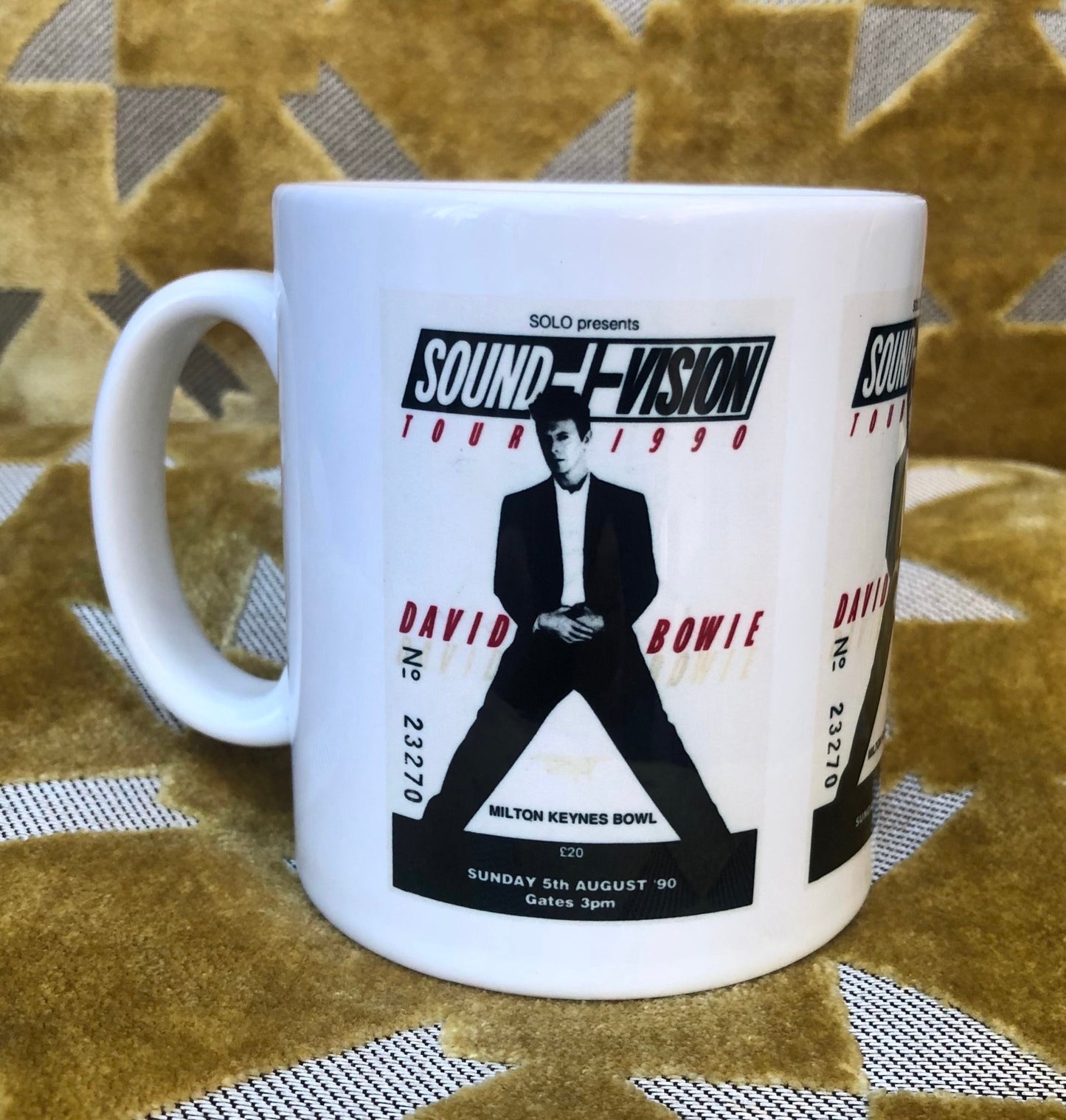 DAVID BOWIE - 11oz ceramic mug featuring the 1990 “ Sound and Vision tour” Milton Keynes Bowl ticket. Featuring three tickets surrounding the mug.